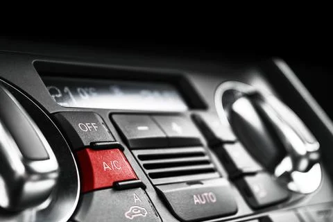 Air conditioning button inside a car. Climate control AC unit in the new ca.. Photos