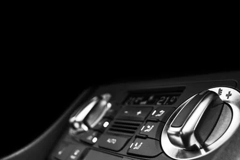 Air conditioning button inside a car. Climate control AC unit in the new ca.. Photos