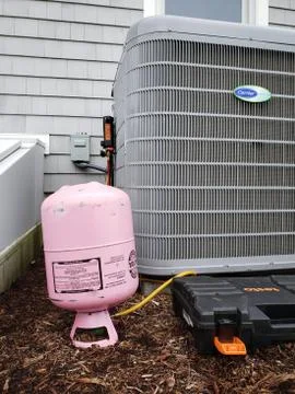 Air Conditioning Condensing Unit Being Charged Stock Photos