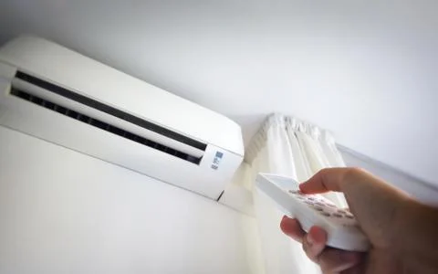 Air conditioning remote control power on and off the split Stock Photos