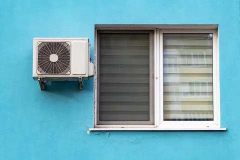 An air conditioning system installed outside Stock Photos