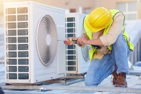 Air conditioning, technician or engineer on roof for maintenance, building or Fotos de archivo