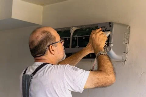 Air conditioning technician Stock Photos
