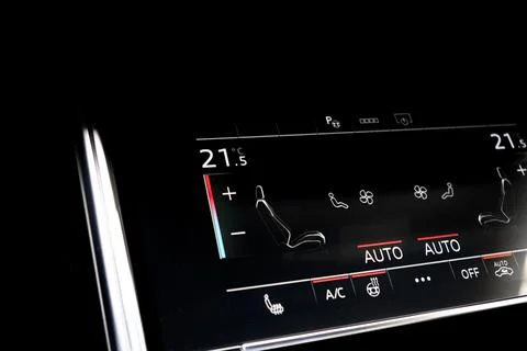Air conditioning touch buttons inside a modern car. Climate control AC unit.. Stock Photos