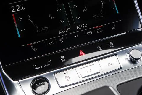 Air conditioning touch buttons inside a modern car. Climate control AC unit.. Stock Photos