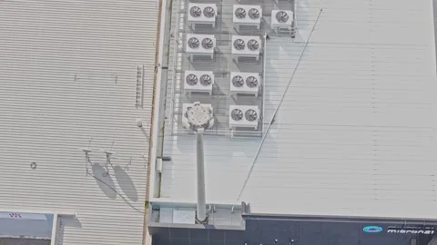 Air conditioning units operating on a rooftop Stock Footage 340594395