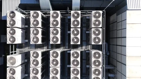 Air conditioning units on the rooftop of a modern office building Stock Footage 338178937