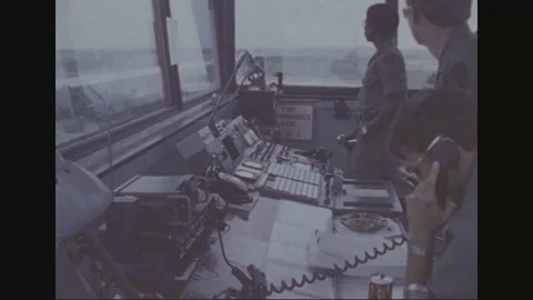 Air controllers inside A-511 Control Tower direct air traffic - 1977 Stock Footage 97929882