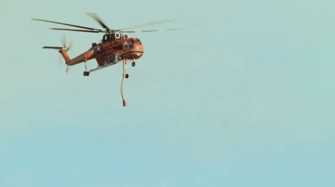 Air Crane helicopter dropping fire retardant Stock-Footage 54642480