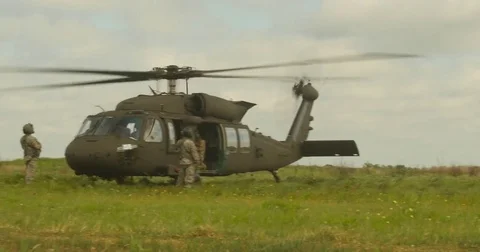 Air Crew Standing By Black hawk Helicopter Video stock 84075890