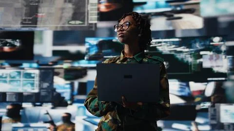 Air defense commander using radar systems on laptop program to detect missiles 写真素材