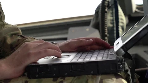 Air Engineer using laptop computer inside cockpit of C-17 Globemaster Stock Footage 98180970