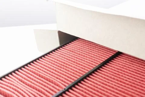 Air filter for internal combustion engine close-up. Paper air filter of car engi Stock Photos