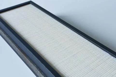 Air filter on a white background. New air filter. Stock Photos