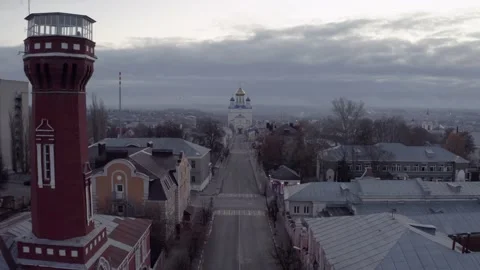 Air flight down the high street to the church early in the morning Stock Footage 194453302