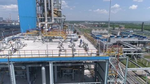 Air flight over factory where 2 engineers work in Sunny weather Video stock 121629596