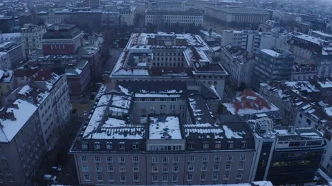 Air flight over Sofia center with buildings and snow on the roofs 스톡 동영상 151415868