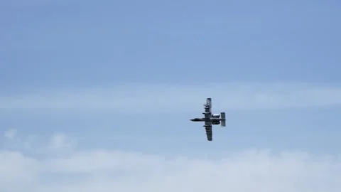 An Air Force A-10 Warthog Thunderbolt II plane attack jet flying on blue sky, 库存影片 246652265