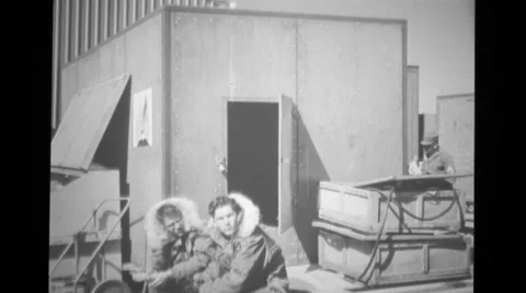 Air Force captain entering shipping crates used as an office Stock Footage 37596362