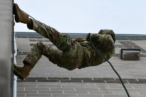 An Air Force Global Strike Command member rappels down a tower on Jan. 25,... Stock Photos
