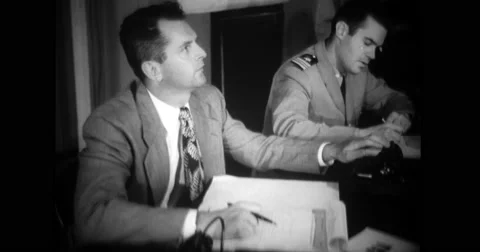 Air force officers working and talking over telephone Stock Footage 43446228
