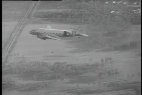 Air force team jump and land on open fields during paramedics competition - 1956 Video stock 99092334