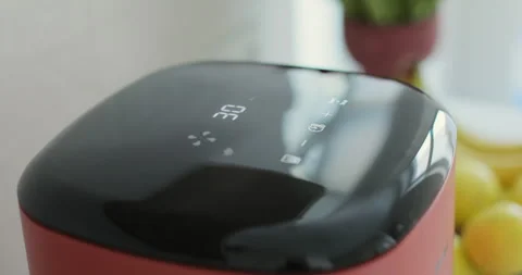 Air fryer cooking with timer counting on the screen. Smart device at home Видео 329155387