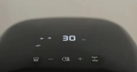 Air fryer cooking with timer counting on the screen. Smart device at home Video stock 329155636