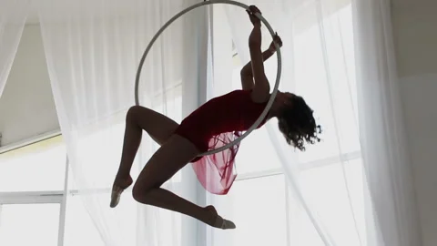 Air gymnastics performs acrobatics tricks on aerial hoop Stock Footage 114411921