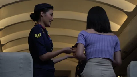 Air hostess checking passenger ticket in airplane Stock Footage 147238521
