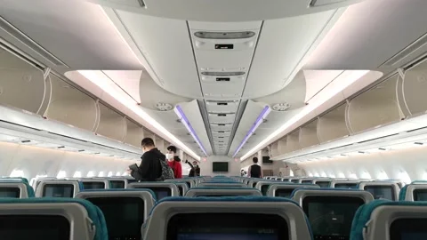 The air hostess is directing the passengers to their seats Stock Footage 170938501