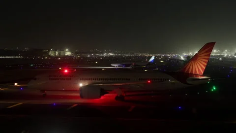 Air India Boeing 787 Passenger Airplane Holding for Takeoff Mumbai Airport Night Stock Footage 253529160