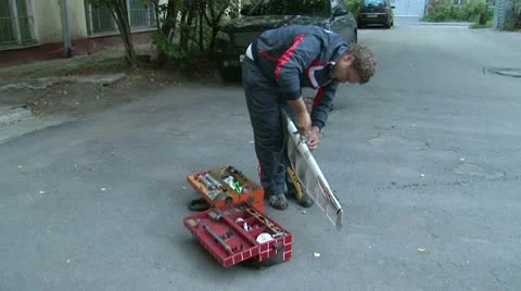 Air-modelist starting the engine of the plane Stock Footage 10745520