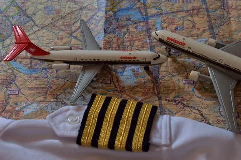 Air navigation map with captain stripes and aircraft toys 25.3.2021 Fotos de archivo