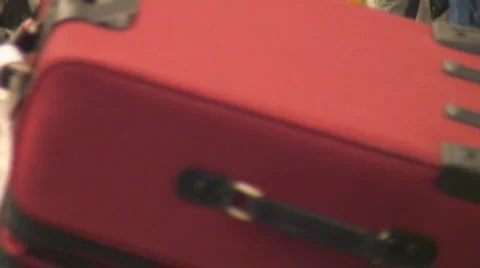 Air passengers collect luggage Stock Footage