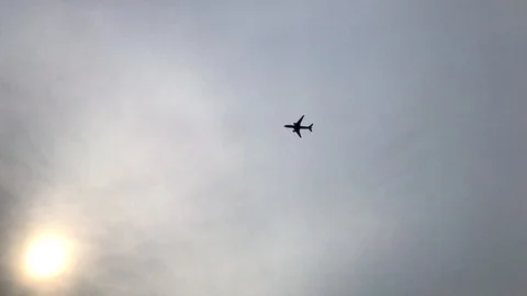 Air Plane Fly Over on Cloudy Day Stock Footage 108472222