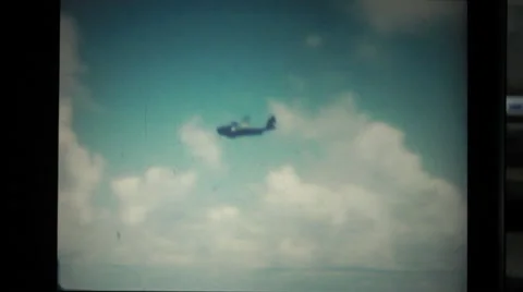 Air plane flying in the sky over the ocean Stock Footage 37597174