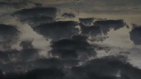 Air Plane Window View, Aerial View, Black Rain Clouds Fly in the Sky in Sun Rays Stock Footage 332216752