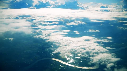 Air plane window view clouds, blue sunny sky Stock Footage 97875638