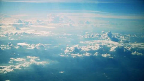Air plane window view clouds, blue sunny sky Stock Footage 97876380