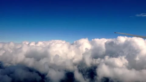 Air plane window view time lapse clouds and blue sunny sky 스톡 동영상 262119869