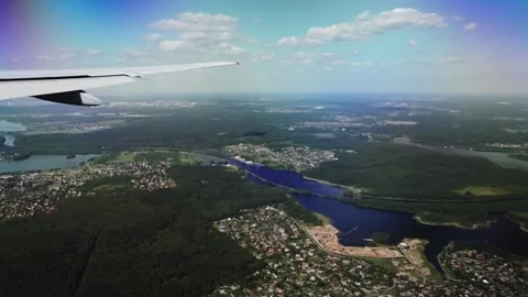 Air plane window view time lapse clouds and blue sunny sky Stockbeeldmateriaal 277017781