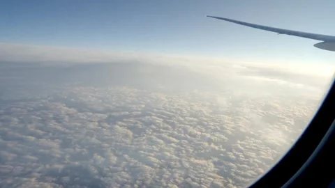 Air plane window view time lapse clouds and blue sunny sky 스톡 동영상 277017783