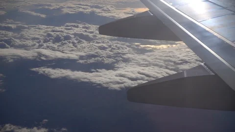 Air Plane wing clouds from above window view Stock Footage 87906711