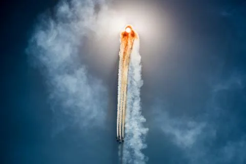 Air planes eclipsed sun on the blue sky during the airshow Stock Photos