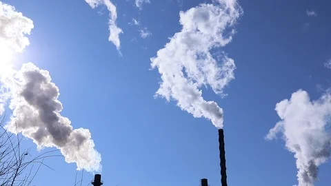 Air Pollution Backlit by Sun Dark Smoke Pouring into Blue Sky Global Warming 動画素材 126980201