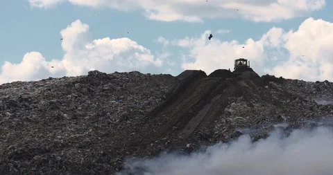 Air pollution caused by fire on dump site. Clouds of smoke above the waste land Stock Footage 157352370