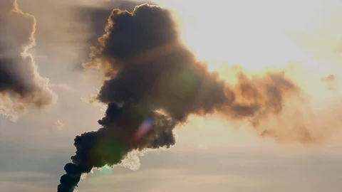 Air Pollution Clouds of Smoke Coming From the Chimney against the sun. Fossil Stock Footage 73160685
