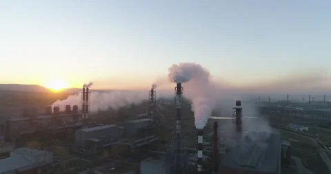 Air pollution. clouds of smoke coming from the chimneys of the plant with Stock Footage 139614370