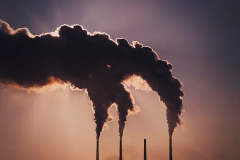 Air pollution clouds of smoke coming from the chimneys. Energy plant Stock Photos